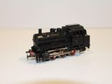 a toy train on a white surface with a white background