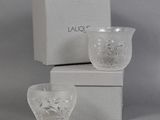 a glass cup and a box on the table