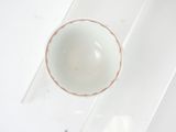 a white bowl sitting on top of a clear table
