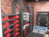 a room that has a bunch of shelves and boxes on it