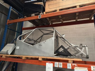 a car that is sitting on a shelf in a warehouse