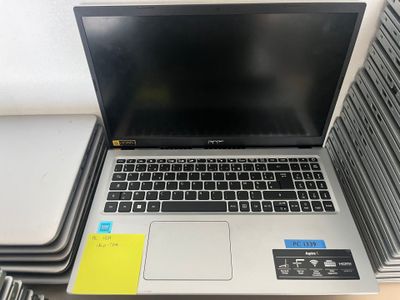a laptop computer sitting on top of a stack of books