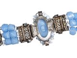 a picture of a bracelet with blue beads on it