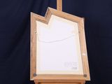 a picture of an easel with a piece of paper on it