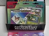 three packs of pokemon trading cards in a display box