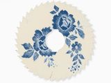 a blue and white floral wreath on a white wall