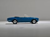 a blue toy car that is sitting on a white surface