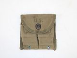 an image of a small pouch with a button on it