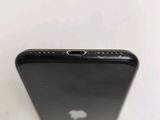 the back of a black iphone with the camera on it ' s side