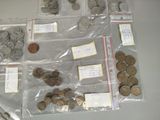a lot of coins in bags on the table