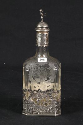 a glass bottle with a silver lid on a black background