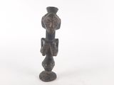 a small bronze statue of a bird on a pedestal