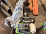 many chainsaws that are laying on the ground