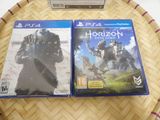 two video games are sitting on top of a table on a table