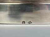 a silver box that has two small diamonds on it