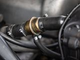 a close up of a motorcycle with a hose attached to it
