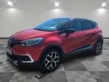 a red renault c - hr suv parked on a checkered floor