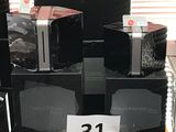 a stack of microwaves that are on display in a store
