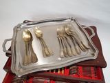 a tray with silverware on top of it on a table