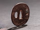 a small coin sitting on top of a table next to a coin