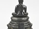an image of a statue of a person sitting on top of a pedestal