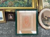 many framed pictures on the wall of this room