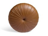 a brown leather ball sitting on top of a white surface