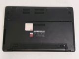 a black laptop with a red sticker on the back of it