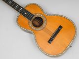 an acoustic guitar with a wooden body and strings on a white background