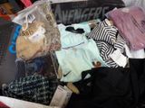a suitcase full of clothes and a teddy bear in it