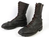 pair of black leather boots with brown laces on a white background