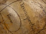 a close up of a vase with writing on it