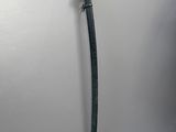 a small sword that is on a white surface