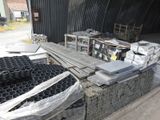 a large pile of metal items in a warehouse
