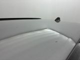 a close up of the hood of a white car