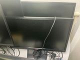 two televisions that are sitting on top of each other