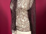 this image may contain a mannequin, clothing, and a piece of clothing