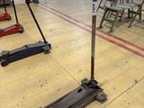 two jack stands on the floor in a warehouse