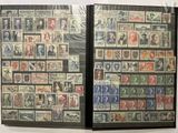 two pages of stamps on display on the wall