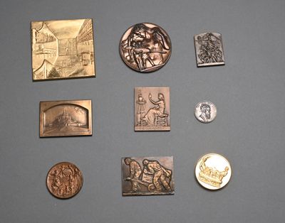 many different types of coins on display on a table