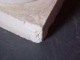 a white bowl sitting on top of a wooden base
