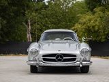 an image of a silver mercedes sports car parked in a parking lot
