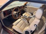beige interior of a car with leather seats and a steering wheel