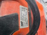 a close up of a chainsaw on a table