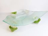 a glass bowl that is sitting on top of a table