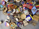a pile of assorted badges on the floor