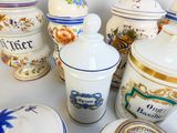many different types of canisters and containers on the table