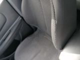 a seat in the back of a car with a cup holder on it