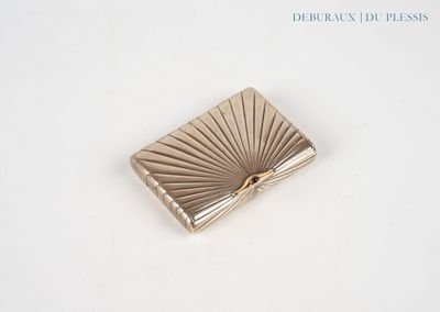 a small gold box with a bow on it