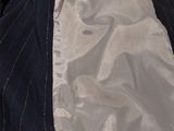 a close up of a man ' s jacket and tie
